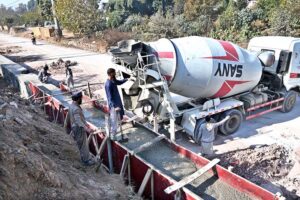 Labourers busy construction work of protection wall along IJP Service Road in the Federal Capital