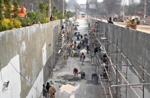 Laboures busy in construction work of Serena Chowk Interchange Project during development work in the Federal Capital.