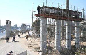 Labourers busy in their work at the site of under construction 10th Avenue during development work in Federal Capital.