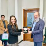 Commerce Minister Jam Kamal Khan presents a commemorative souvenir to US Charge d'Affaires Natalie A. Baker at the conclusion of their meeting, highlighting the strengthening of Pakistan-US trade and investment ties