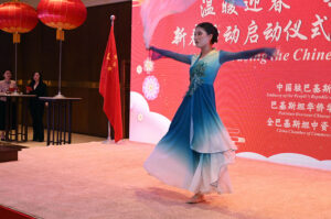 Artisit performing on stage during an event regarding Chinese New Year