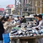 Vendors selling shoes at their roadside setup in Commercial Market