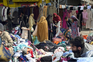 People busy selecting and purchasing second-hand clothes from the vendors at Ganj Mandi.