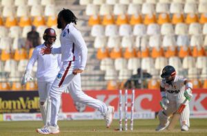 West Indies' bowler Jomel Warrican celebrate the dismissal of Pakistan's Muhammad Rizwan during the third day of the second Test cricket match between Pakistan and West Indies at the Multan Cricket Stadium.