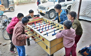 Youngsters enjoying the football game at Latifabad.