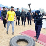 A police official experiencing a fittness tool during the opening ceremony of health & Fitness Gala at Police Lines