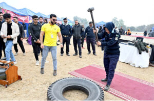 A police official experiencing a fittness tool during the opening ceremony of health & Fitness Gala at Police Lines