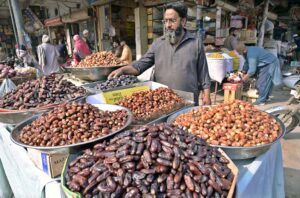 A vendor displaying dates on his roadside setup at Muslim Bazaar.
