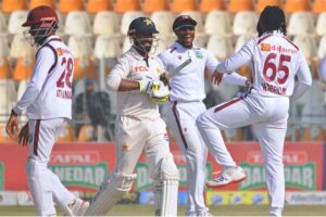 West Indies' bowler Jomel Warrican celebrate the dismissal of Pakistan's Muhammad Rizwan during the third day of the second Test cricket match between Pakistan and West Indies at the Multan Cricket Stadium.
