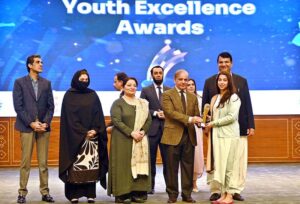 Prime Minister Muhammad Shehbaz Sharif giving away awards to high achievers at the inaugural session of the Commonwealth Asia Youth Alliance summit.