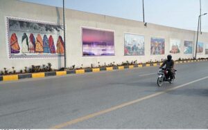 A view of pictures of wall of bridge at Rawal Chowk in Federal Capital.
