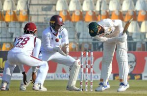 West Indies' bowler Jomel Warrican celebrate the dismissal of Pakistan's Muhammad Rizwan during the third day of the second Test cricket match between Pakistan and West Indies at the Multan Cricket Stadium.