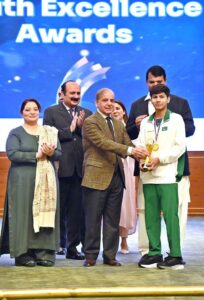 Prime Minister Muhammad Shehbaz Sharif giving away awards to high achievers at the inaugural session of the Commonwealth Asia Youth Alliance summit.