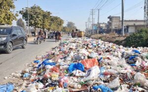 A heap of garbage spread on road at Lehtrar Road creating environment problems and needs the attention of concerned authorities.