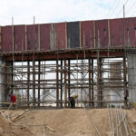 Laborers busy construction of 10th Avenue bridge in the federal capital