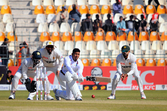West Indies' Gudakesh Motie plays a shot during the first day of the second Test cricket match between Pakistan and West Indies at the Multan Cricket Stadium