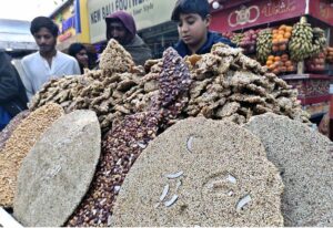 A vendor selling traditional sweet potatoes at Royal Road