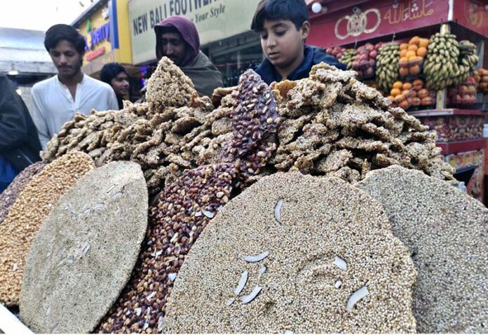 A vendor selling traditional sweet potatoes at Royal Road