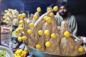 A vendor selling traditional sweet potatoes at Royal Road
