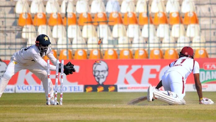 Pakistani wicketkeeper Mohammad Rizwan stumps out West Indies' captain Kraigg Brathwaite during the 2nd day of the second Test cricket match between Pakistan and West Indies at the Multan Cricket Stadium