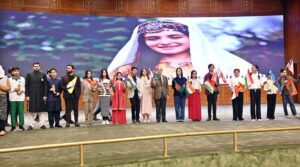 Prime Minister Muhammad Shehbaz Sharif with youngsters who perform tableau at the inaugural session of the Commonwealth Asia Youth Alliance summit.