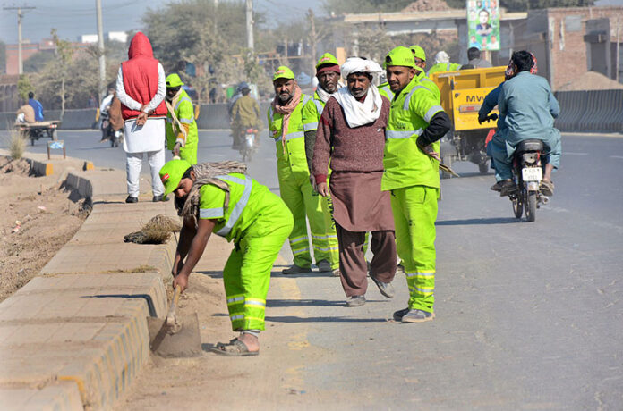 Multan Waste Management Company workers busy cleaning Old Shujabad Road