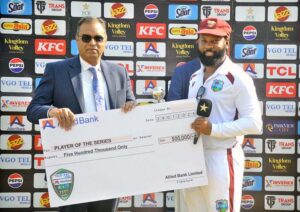 West Indies' Jomel Warrican receiving Player of the Series Award during prize distribution ceremony after third day of the second Test cricket match between Pakistan and West Indies at the Multan Cricket Stadium.