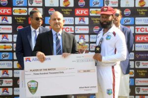 West Indies' Jomel Warrican receiving Player of the Series Award during prize distribution ceremony after third day of the second Test cricket match between Pakistan and West Indies at the Multan Cricket Stadium.