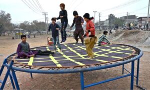 Children enjoy sliding in a local park