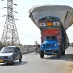 A overloaded truck carrying dry hay violates traffic laws, creating a safety hazard authorities urged to take immediate action at Tando Yousuf Flyover in the city