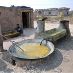 Workers busy in making traditional sweet ‘gurr’ at Khushab Road