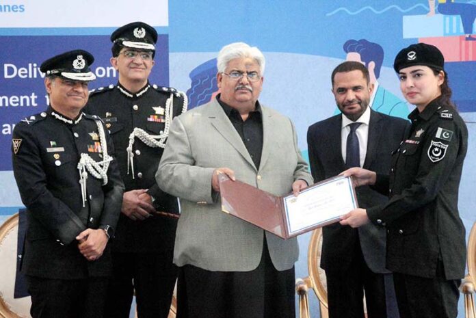 Chairman Federal Board of Revenue Rashid Mahmood Langrial presents certificates of appreciation to the officers on their outstanding performance during the ceremony held to mark International Customs Day at the Customs House Karachi