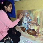 An art student participate to show her creativity in an arts and painting competition organized by the Knowledge of Art Academy at Ravi Road