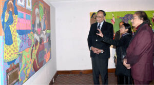 Federal Minister for Planning Development and Special Initiatives Prof. Ahsan Iqbal, watching the exhibition of the Master's Degree Show at the National College of Arts.