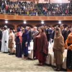 Education activist and Nobel Peace Prize winner, Malala Yousafzai along with other participants stands in honor of the national anthem during the International Conference on Girls' Education 2025 at Jinnah Convention Centre