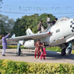 Children visiting the provincial capital play along with the plane enjoying their vacations at China Chowk