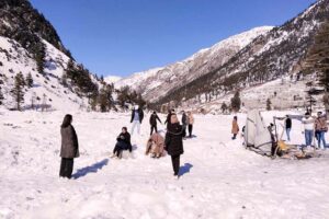 Tourists enjoying a day on snow at Panjota Picnic Point during their visit
