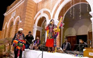 Folk singer Taj Mastani performing on the stage during music evening at Basant Hall.