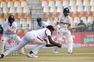 West Indies' Justin Greaves takes a catch to dismiss Pakistan's Saud Shakeel during the third day of the first Test cricket match between Pakistan and West Indies at the Multan Cricket Stadium