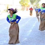 Students participating in sack race competition during Annual Sports Day at Begum Nusrat Bhutto Government Girls Degree College