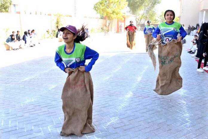 Students participating in sack race competition during Annual Sports Day at Begum Nusrat Bhutto Government Girls Degree College
