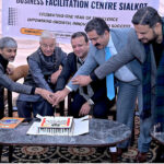 Defense Minister Khawaja Muhammad Asif cutting cake ceremony of one year celebrating the completion Business Facilitation canter at BFC