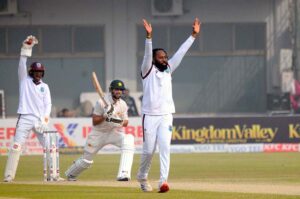 West Indies' Justin Greaves takes a catch to dismiss Pakistan's Saud Shakeel during the third day of the first Test cricket match between Pakistan and West Indies at the Multan Cricket Stadium