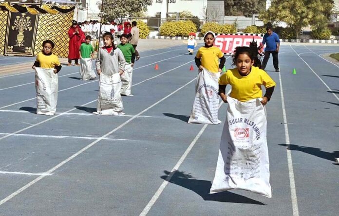 Students participating in sack race organized by the City School Qasimabad during Sports Gala 2025 at Sports Complex