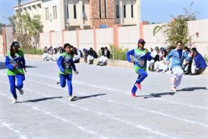 Students participating in sack race competition during Annual Sports Day at Begum Nusrat Bhutto Government Girls Degree College