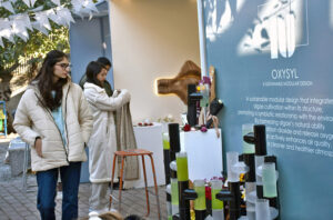Female students admire the creative art pieces on display at the Master's Degree Show exhibition, held at Shakir Ali Auditorium, National College of Arts in the city .