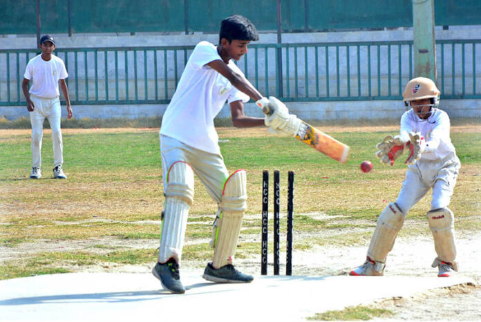 Players in action in cricket match between Govt. Comprehensive Boys High School and Seth Kamaluddin High School team during Ufone U-16 Inter School Cricket Tournament Organized by DCA at Afzal Cricket Ground