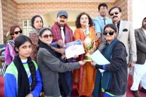 Regional Director Colleges Professor Altaf Hussain Abro along with Principal Begum Nusrat Bhutto Government Girls Degree College, Prof. Samina Naz Abro and others giving away winner trophy of Throw Ball competition during Annual Sports Day at BNB Girls College
