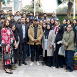 Participants pose for group photo during Workshop on the importance and Practicality of Digital Photography Organized by the Department of Communication, The University of Faisalabad