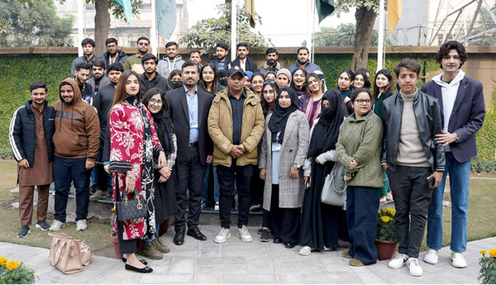 Participants pose for group photo during Workshop on the importance and Practicality of Digital Photography Organized by the Department of Communication, The University of Faisalabad